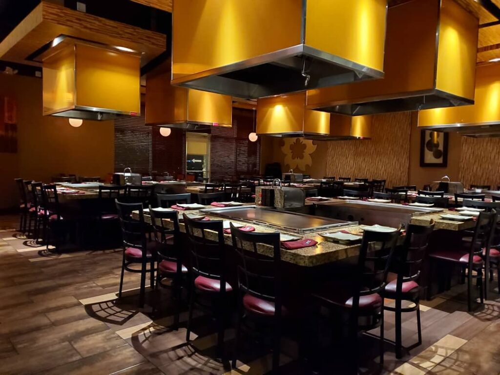 Interior of Hokkaido Teppanyaki Hibachi Steakhouse with tables and teppanyaki grills