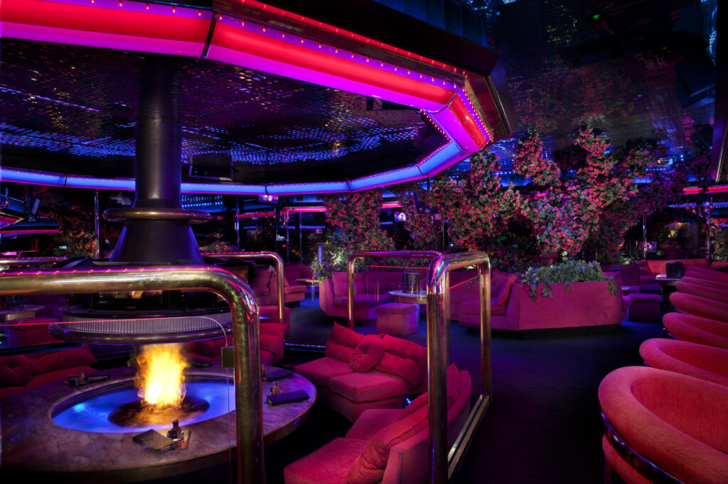 Interior of Peppermill Restaurant and Fireside Lounge in Las Vegas with a retro-style decor and a large fireplace.